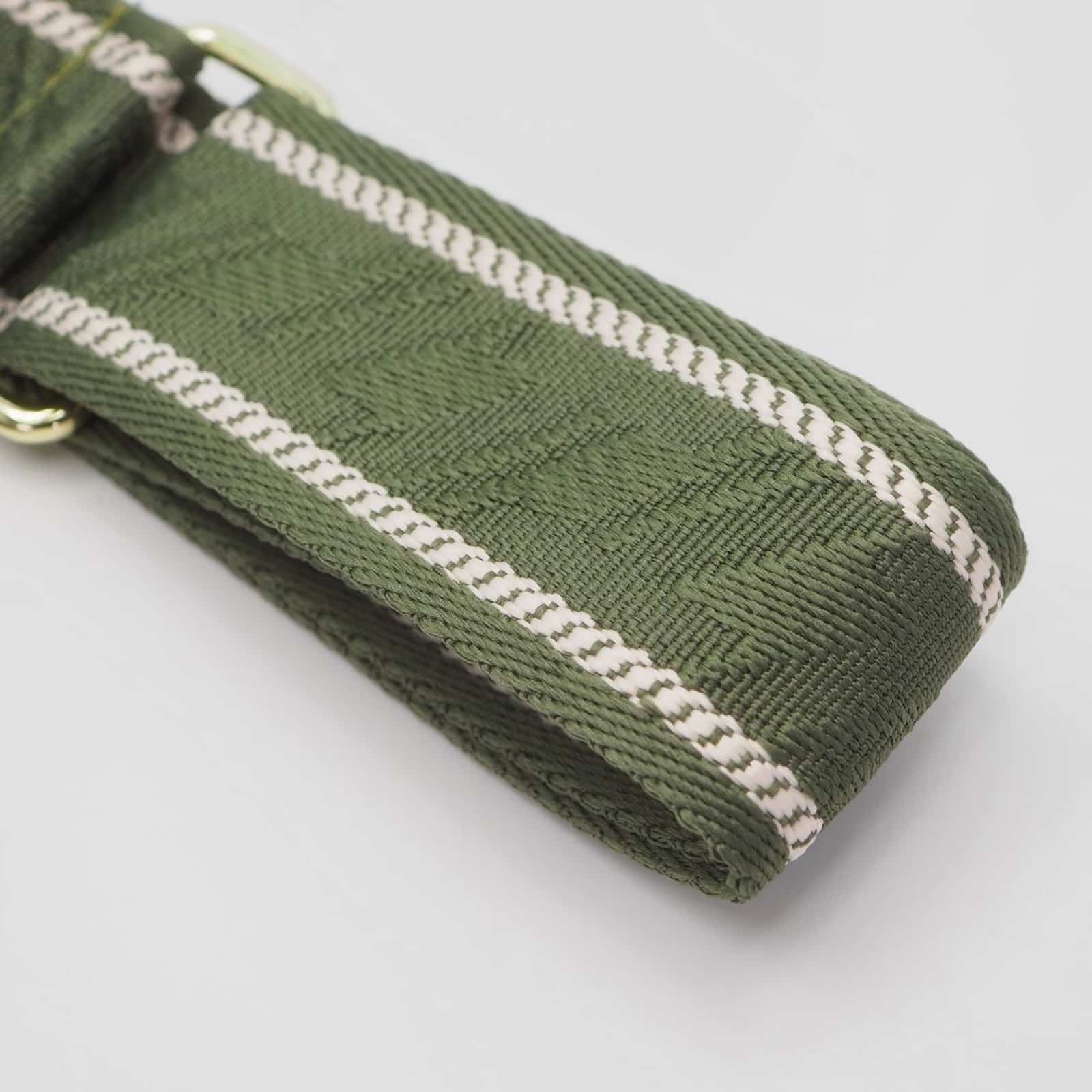 Veskestropp med houndstooth-mønster med skinndetaljer, oliven