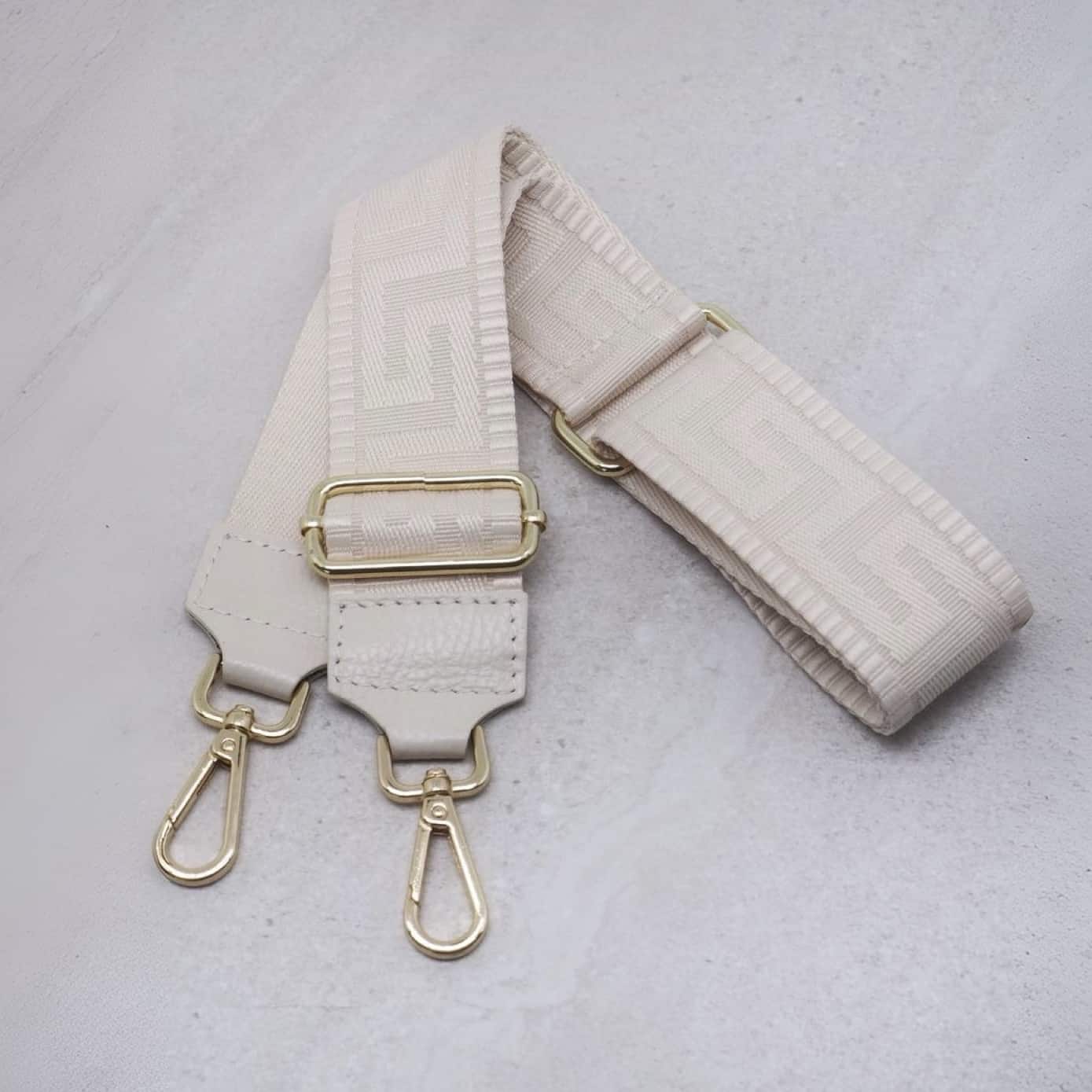 Veskestropp med skinndetaljer, gresk mønster - off-white
